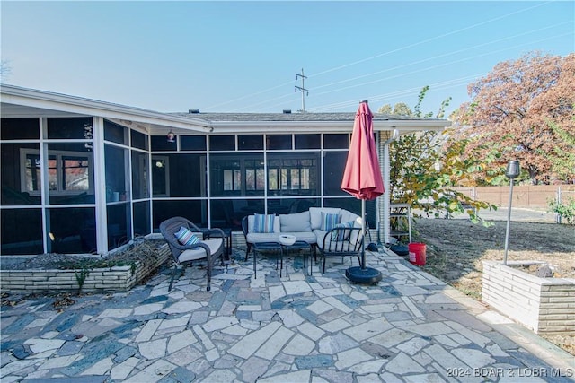 view of patio featuring a sunroom and an outdoor hangout area