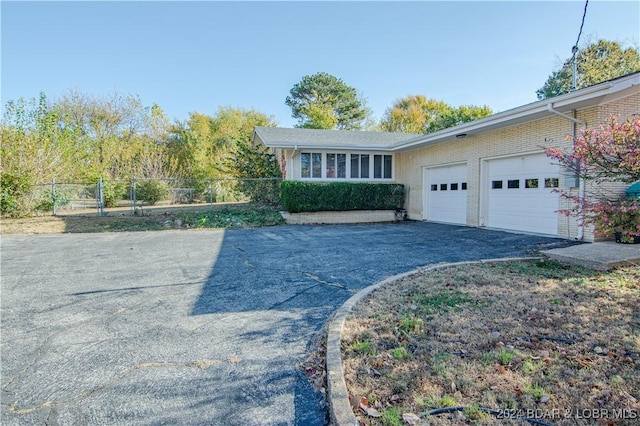 view of front of home featuring a garage