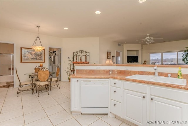 kitchen featuring white cabinets, ceiling fan, sink, pendant lighting, and dishwasher