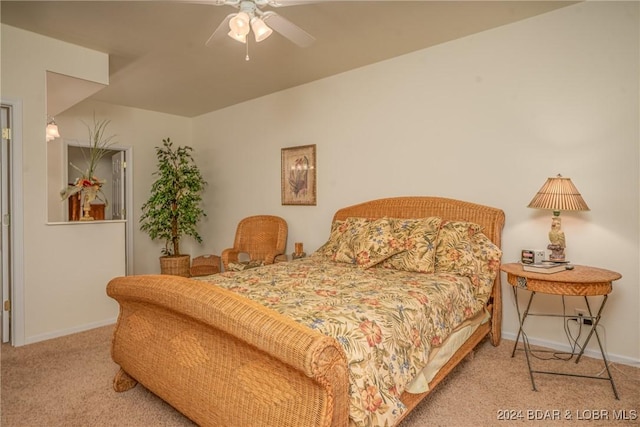 bedroom featuring ceiling fan and light colored carpet