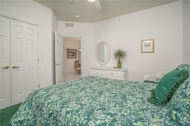 bedroom with ceiling fan, a closet, and carpet