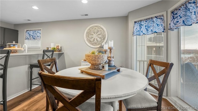 dining room with wood-type flooring