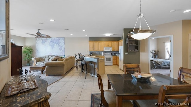 dining room with ceiling fan and light tile patterned floors