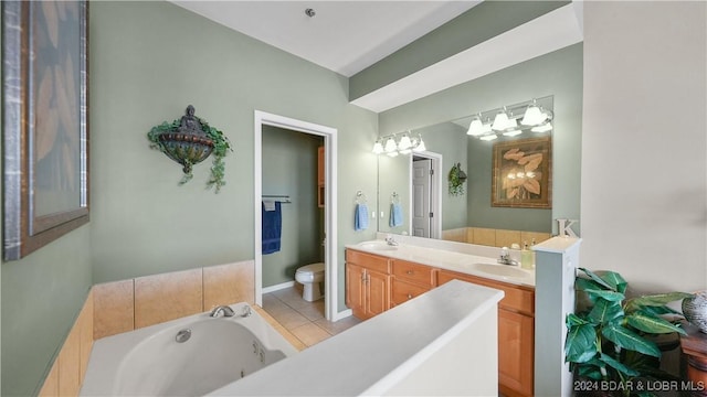 bathroom featuring a tub to relax in, tile patterned flooring, vanity, and toilet