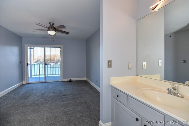 bathroom with ceiling fan and vanity