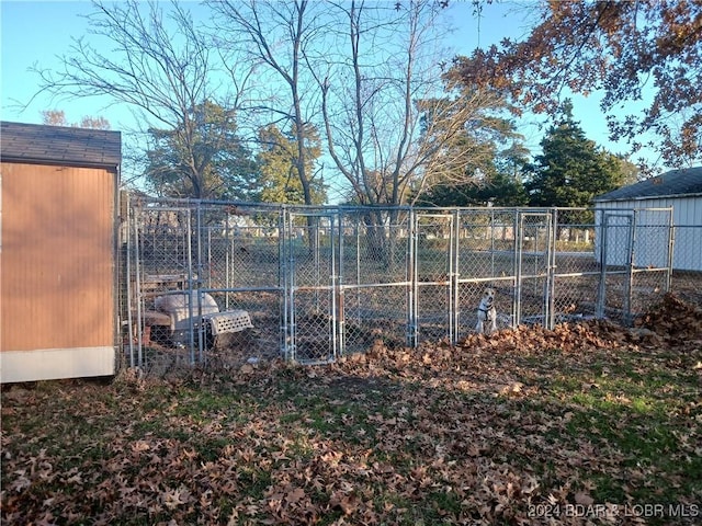 view of gate featuring an outdoor structure