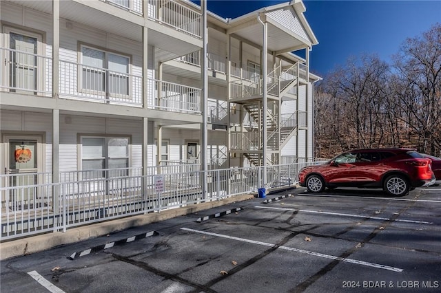 5450 Christopher Ln Unit 415, Osage Beach, MO 65065 - view of building exterior with uncovered parking