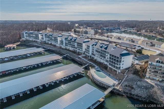 birds eye view of property featuring a water view