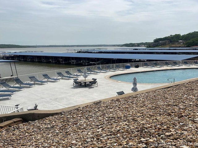 5450 Christopher Ln Unit 415, Osage Beach, MO 65065 - community pool with a patio area and a water view