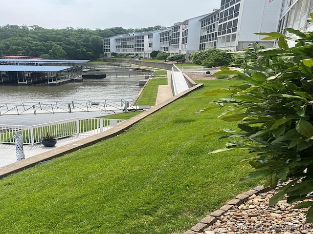 5450 Christopher Ln Unit 415, Osage Beach, MO 65065 - view of property's community with a water view, a yard, and a dock