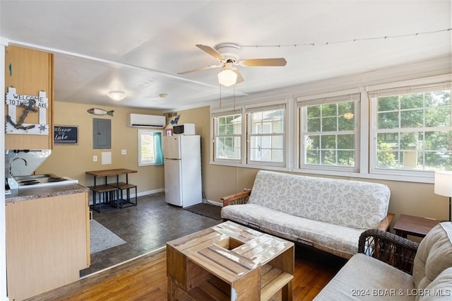 living room with ceiling fan, sink, a wall mounted air conditioner, dark hardwood / wood-style floors, and electric panel