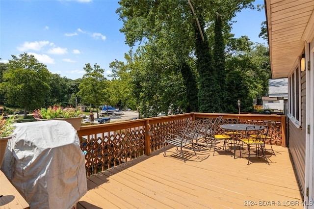 wooden terrace featuring grilling area