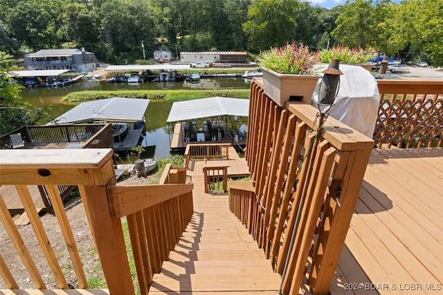 wooden deck featuring a water view