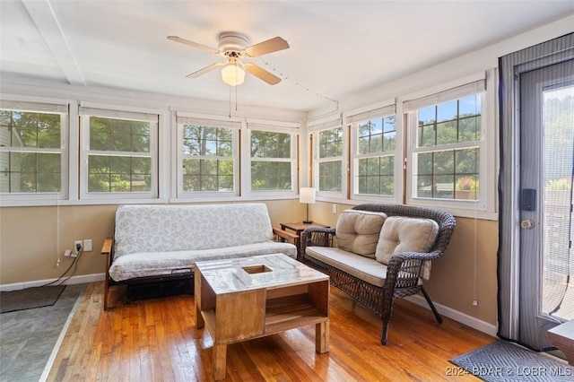 sunroom featuring ceiling fan