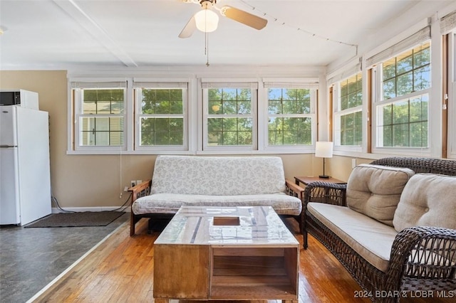 sunroom with ceiling fan and a wealth of natural light