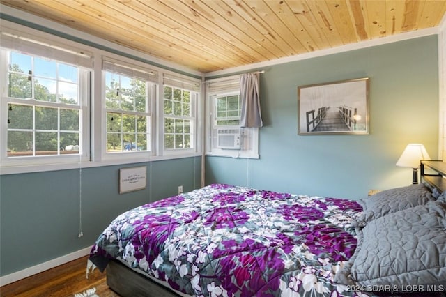 bedroom with crown molding, hardwood / wood-style floors, cooling unit, and wood ceiling