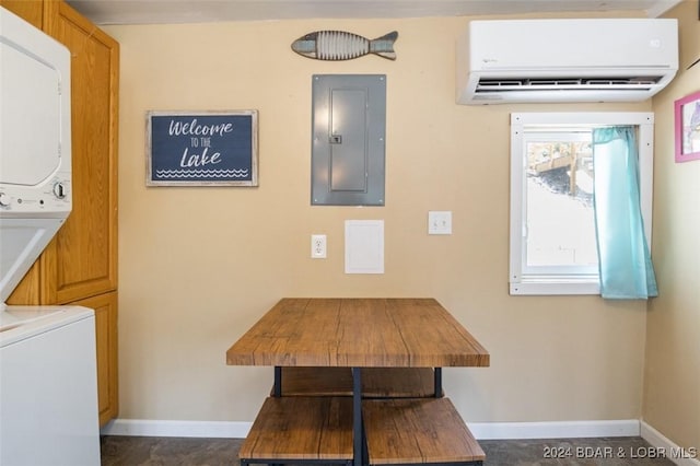 interior space with stacked washer and dryer, electric panel, and a wall mounted AC