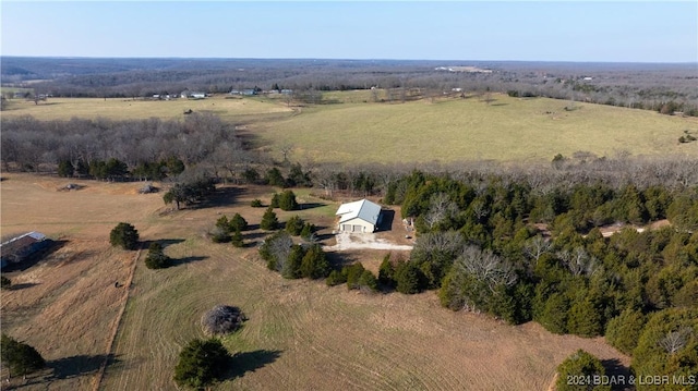 birds eye view of property with a rural view