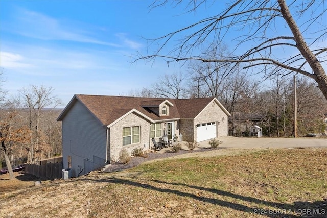 view of front of property with a garage and a front yard