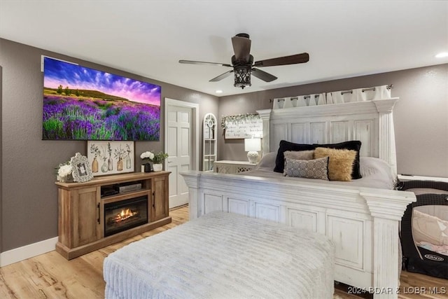 bedroom featuring ceiling fan and light hardwood / wood-style floors