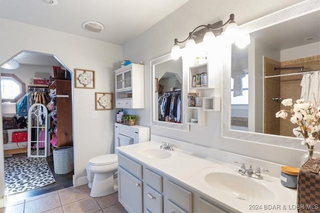 bathroom with curtained shower, toilet, vanity, and hardwood / wood-style flooring