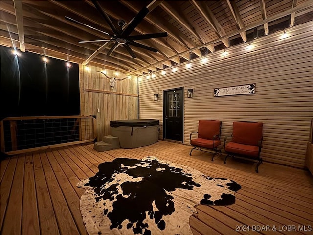 deck with a hot tub and ceiling fan