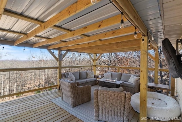 wooden deck with an outdoor living space