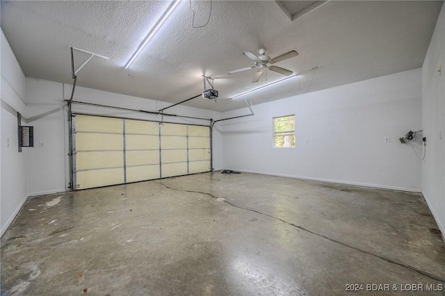 garage with electric panel and ceiling fan