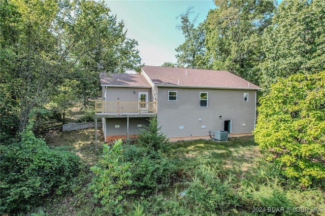 back of house with central AC and a wooden deck