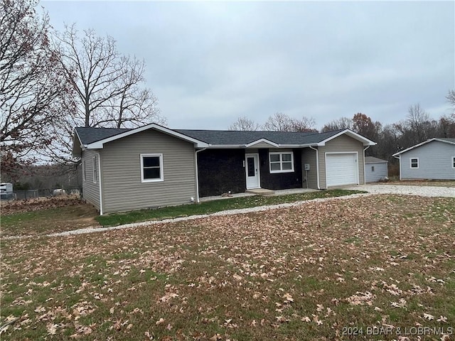 single story home with a garage