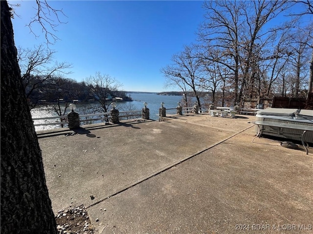 view of patio featuring a water view