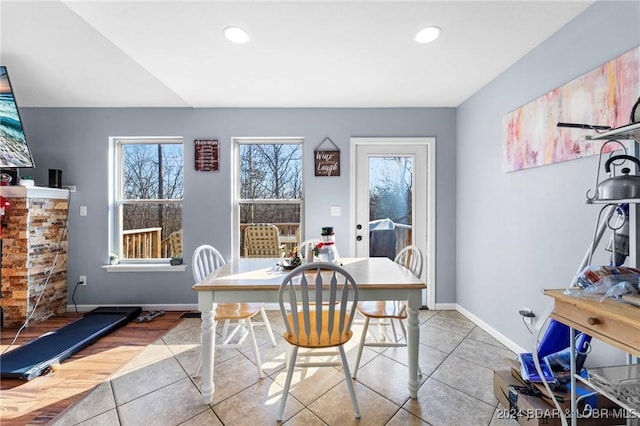 tiled dining area featuring a wealth of natural light