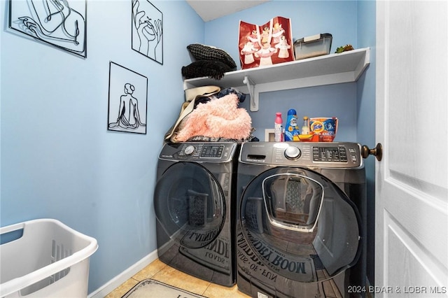 clothes washing area with independent washer and dryer and tile patterned floors