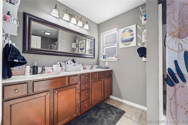 bathroom featuring tile patterned flooring and vanity