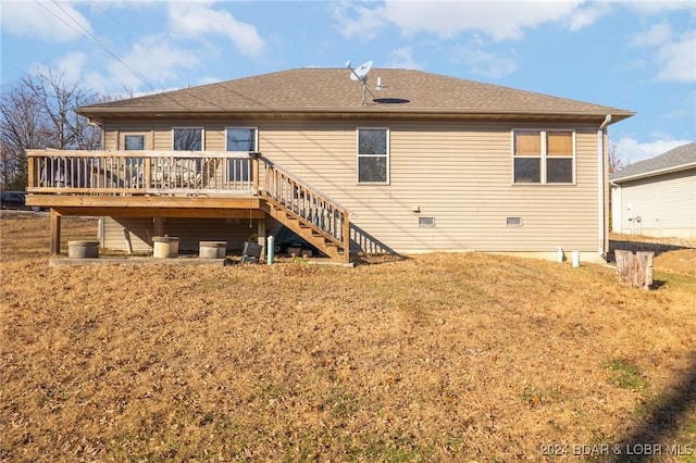 rear view of property featuring a deck