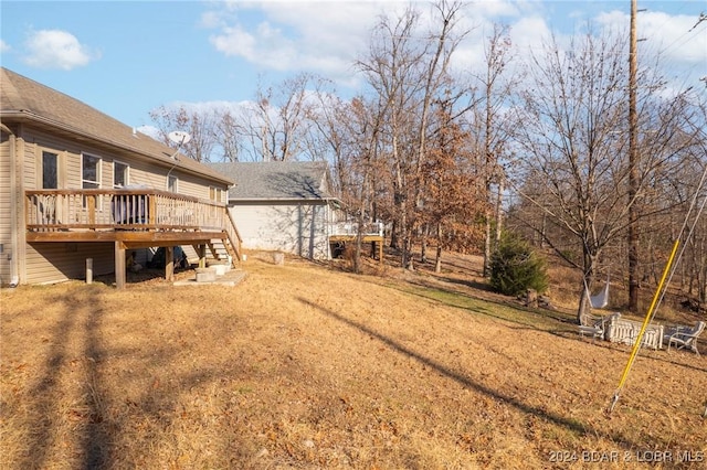 view of yard with a wooden deck