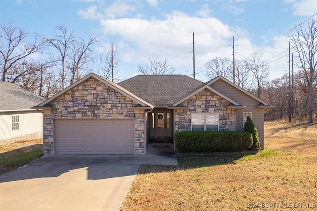 ranch-style house featuring a front yard and a garage