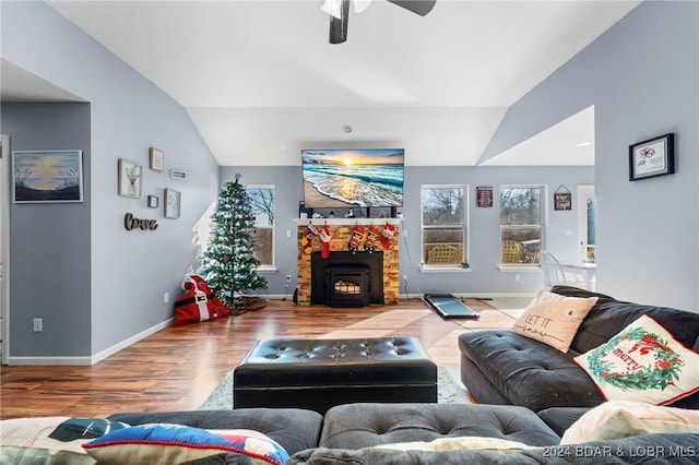 living room with wood-type flooring, ceiling fan, and lofted ceiling