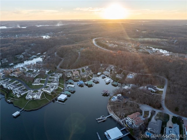 aerial view at dusk with a water view