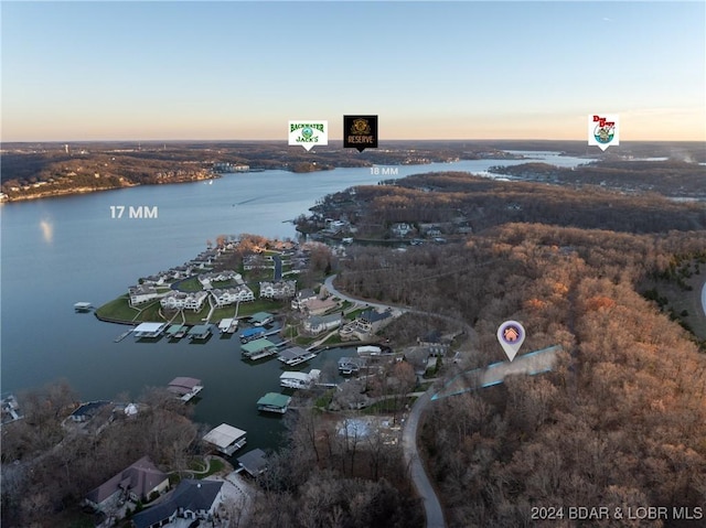 aerial view at dusk with a water view