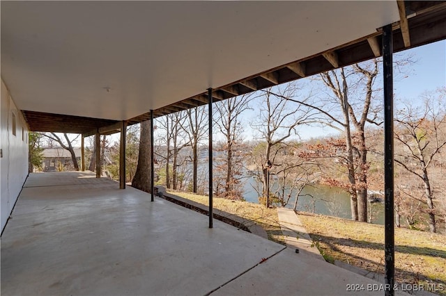 view of patio with a water view