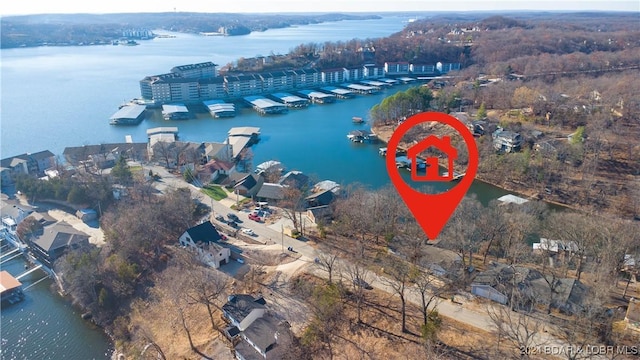 birds eye view of property featuring a water view