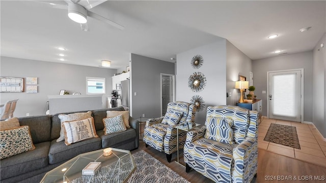 living room featuring tile patterned flooring and ceiling fan