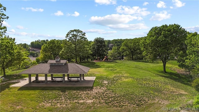 surrounding community featuring a gazebo and a yard