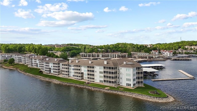 birds eye view of property with a water view