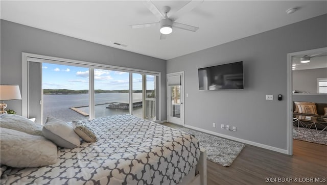 bedroom with dark hardwood / wood-style floors, ceiling fan, and access to exterior