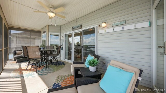 exterior space featuring ceiling fan