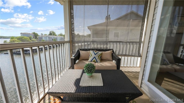 balcony featuring a water view