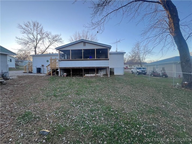 back of property with a wooden deck