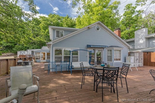 deck featuring outdoor dining area